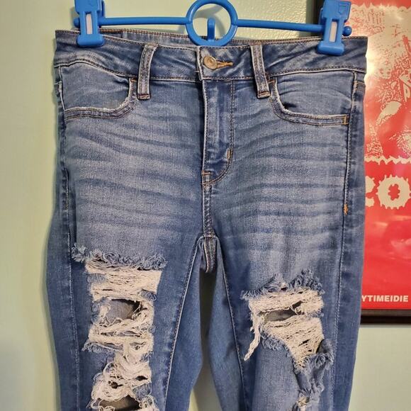 American Eagle Heavily Distressed Stretch Skinny Jeans Distressed Medium Wash - Picture 4 of 12